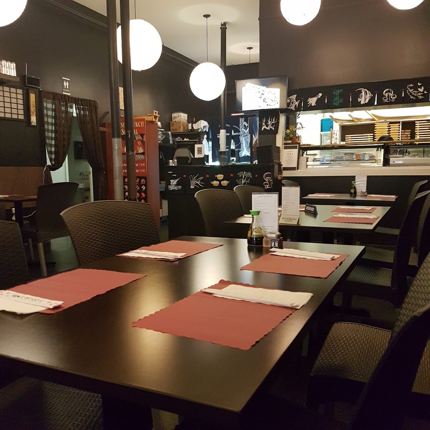 The dining room and sushi bar inside TA-KE Sushi at 92 Queen Street