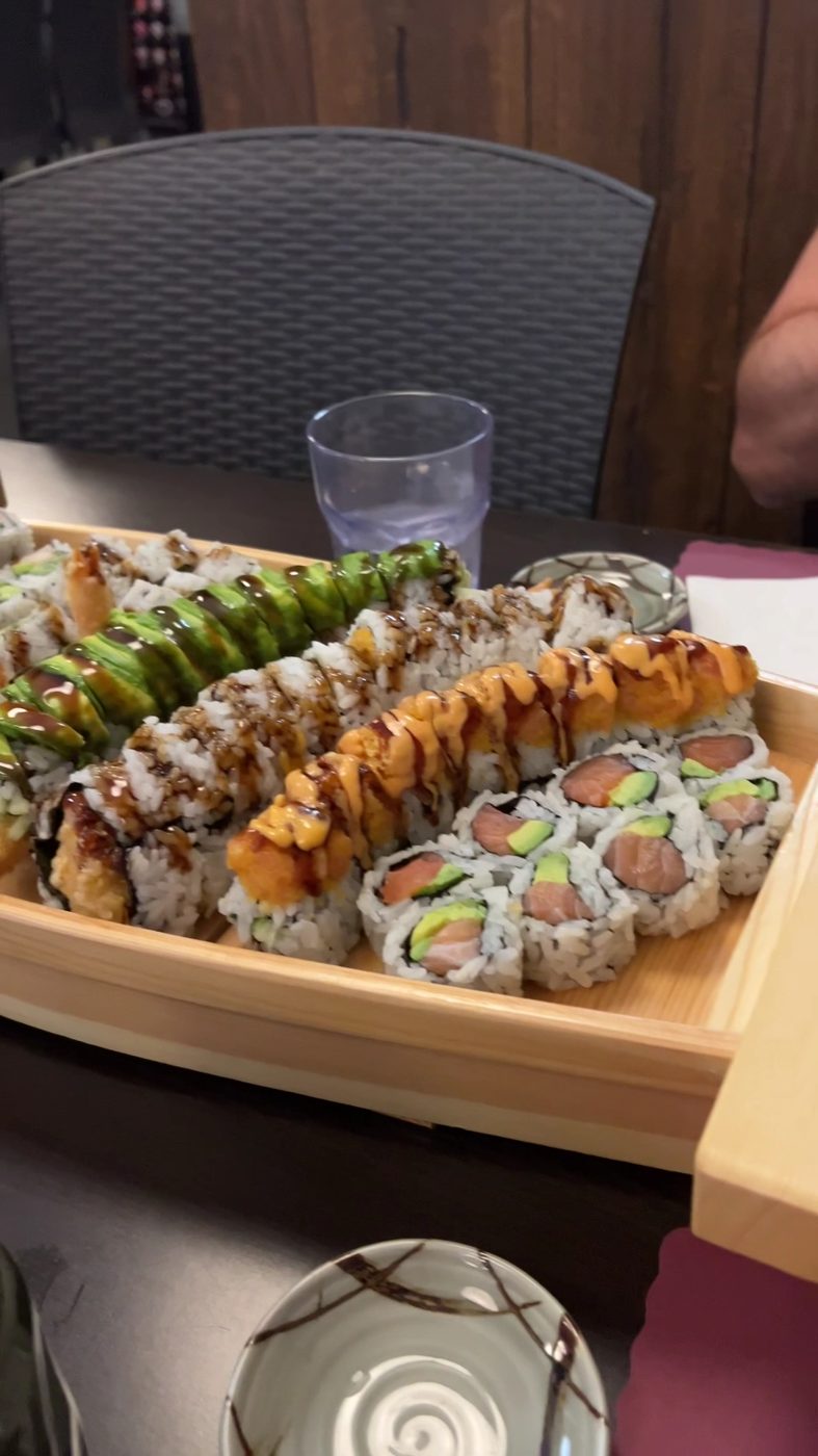 A maki platter served on a wooden boat tray